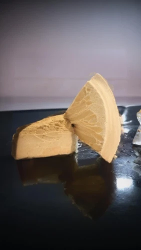 wooden spinning top,dugout canoe,scrub plane,surfboard wax,parmigiano-reggiano,smoothing plane,turrón,butter melting,coconut oil on wooden spoon,wooden sled,laminated wood,water jet,semifreddo,isolated product image,sanding block,tamagoyaki,wooden spool,wood shaper,gelatin dessert,baumkuchen