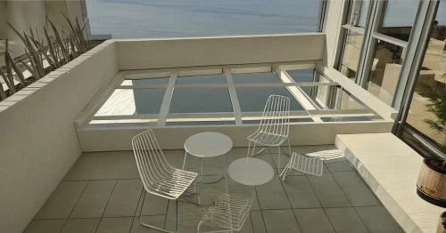 block balcony,window with sea view,balcony,transparent window,patio furniture,balconies,balcony garden,penthouse apartment,sky apartment,window screen,outside staircase,structural glass,metal railing,contemporary decor,beach furniture,folding table,outdoor furniture,observation tower,observation deck,spiral stairs