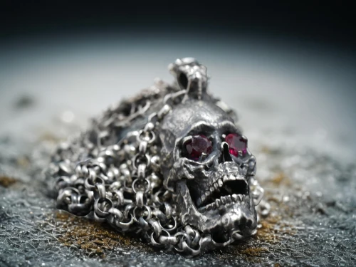 grave jewelry,diamond pendant,silver octopus,metalsmith,skull sculpture,molten metal,saw chain,house jewelry,jewlry,silversmith,metal pile,gift of jewelry,iron chain,hamsa,body jewelry,bicycle chain,pewter,cochineal,silver pieces,amulet