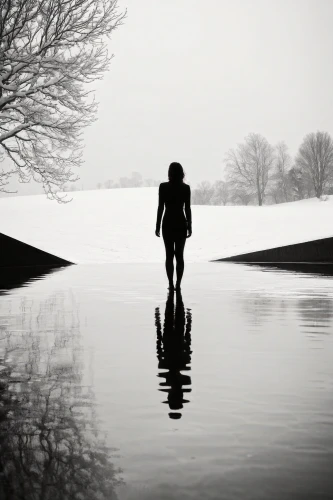 walk on water,reflecting pool,wading,the man in the water,girl walking away,submerged,flooded pathway,reflection in water,in water,girl on the river,conceptual photography,immersed,the body of water,black landscape,woman walking,waterscape,puddle,body of water,monochrome photography,isolated
