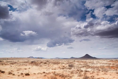 arid landscape,desert desert landscape,mesquite flats,desert landscape,namib rand,towering cumulus clouds observed,namibia nad,namibia,landscape photography,volcanic landscape,arid land,high desert,mexican hat,dry weather,steppe,herman national park,the dry season,big bend,namib,namib desert