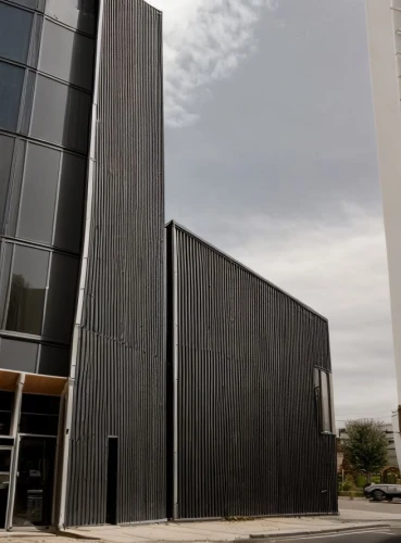 metal cladding,facade panels,new building,performing arts center,kettunen center,modern building,building exterior,wooden facade,christ chapel,new city hall,music conservatory,office building,modern architecture,glass facade,performance hall,data center,the building,houston methodist,multi storey car park,commercial building