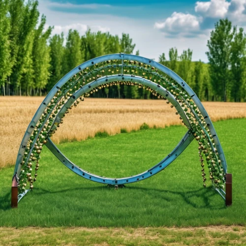 semi circle arch,stargate,circle shape frame,harp with flowers,hula hoop,green wreath,steel sculpture,bicycle wheel,garden sculpture,round arch,inflatable ring,hoop (rhythmic gymnastics),oval frame,aerial hoop,circus aerial hoop,kinetic art,three centered arch,dna helix,garden swing,chair in field