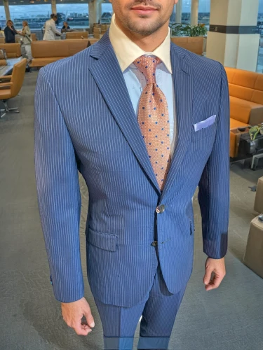 men's suit,wedding suit,navy suit,suit trousers,a black man on a suit,suit actor,businessman,suit,the suit,men's wear,ceo,silk tie,business man,businessperson,men clothes,white-collar worker,blue checkered,real estate agent,formal guy,banker