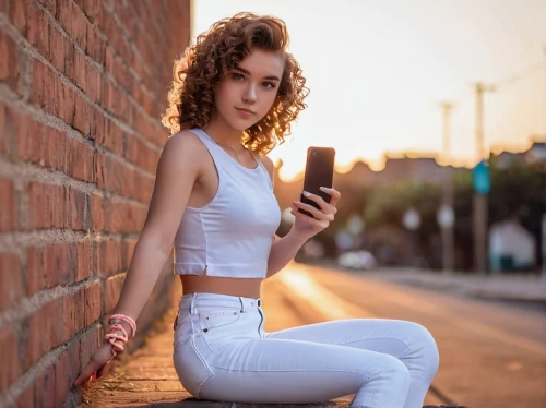 girl making selfie,girl in overalls,on the phone,midriff,texting,woman holding a smartphone,jehane,madi,tianna,jeans background,petite,overalls,white shirt,sms,holding ipad,a girl with a camera,brick background,lora,white skirt,phone,Unique,Pixel,Pixel 01