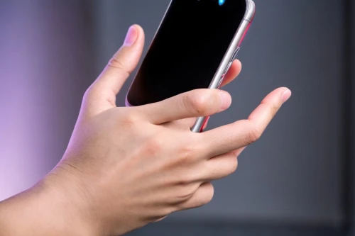woman holding a smartphone,touchsmart,handyphone,the gesture of the middle finger,touchscreen,handphone,ifa g5,celular,jolla,htc,meizu,touch screen hand,mobipocket,siri,viewphone,touch finger,handset,lumia,mobitel,hand detector