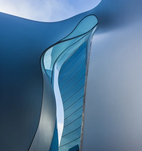 futuristic architecture,morphosis,tail fin,wind edge,blue caves,the blue caves,arcology,sky space concept,blue cave,water wall,water stairs,tail fins,celtic harp,futuristic landscape,sinuous,skybridge,tailfin,harp,shard of glass,flumes,Photography,General,Realistic