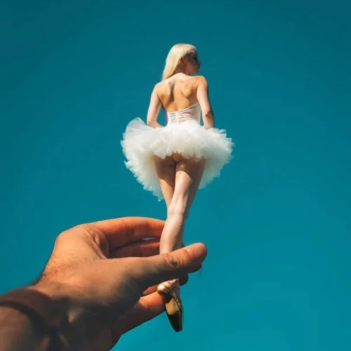 ostrich feather,burlesque,antwoord,conceptual photography,angel figure,white feather,tutu,shaggy mane,handcock,poppycock,ballerina,naturism,lepiota,naturists,marylyn monroe - female,cockiness,on a stick,white fur hat,objectification,cattelan