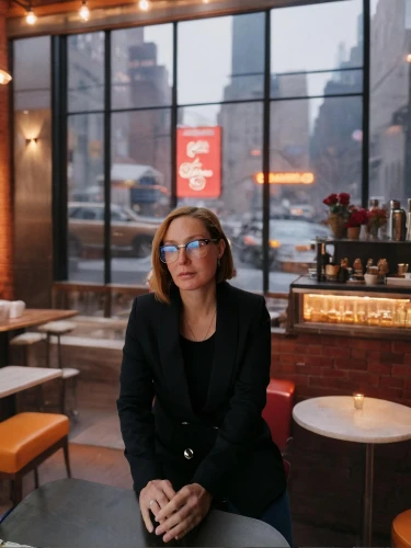 woman at cafe,new york restaurant,kirienko,niffenegger,restauranteur,sobchak,women at cafe,woman drinking coffee,barista,tribeca,brooklynite,with glasses,restaurateur,nabiullina,librarian,woman in menswear,leibovitz,square bokeh,giada,nytphotos