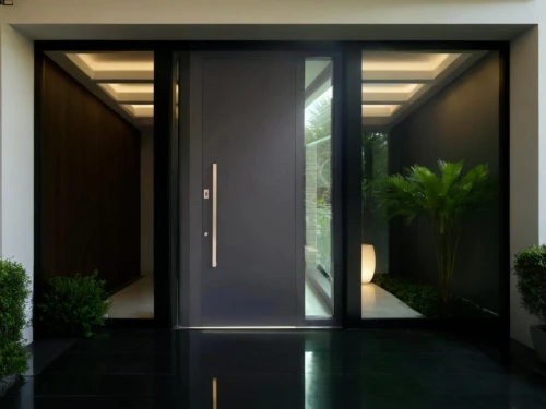 metallic door,hinged doors,hallway space,entryway,entryways,room door,levator,house entrance,the threshold of the house,entranceway,steel door,hallway,dark cabinetry,entranceways,corten steel,search interior solutions,interior modern design,doorways,foyers,amanresorts