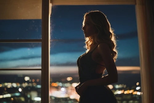 woman silhouette,silhouette,mermaid silhouette,silhouetted,art silhouette,photo session at night,the silhouette,dance silhouette,window view,city lights,night photo,silhouettes,back light,soir,blonde woman,silhouette against the sky,night light,night photograph,bedroom window,citylights,Photography,General,Cinematic