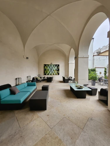 loggia,patio,casa fuster hotel,ceramic floor tile,cortile,roof terrace,vaulted ceiling,inside courtyard,stone floor,courtyard,concrete ceiling,stucco ceiling,masseria,courtyards,terrazza,stucco wall,patios,porticus,patio furniture,villa cortine palace