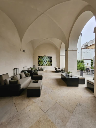 loggia,ceramic floor tile,patio,casa fuster hotel,stone floor,vaulted ceiling,porticus,cortile,concrete ceiling,casalesi,inside courtyard,stucco wall,travertine,courtyard,masseria,roof terrace,stucco ceiling,patios,villa cortine palace,courtyards