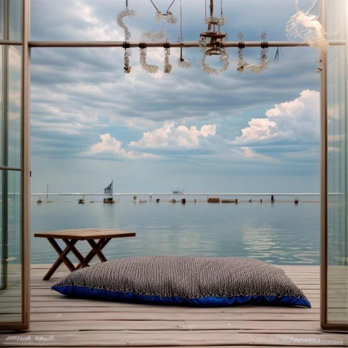 window with sea view,daybed,water sofa,beach furniture,beach house,seaside view,sleeping room,house by the water,chaise lounge,ocean view,beachhouse,sky apartment,blue pillow,blue room,daybeds,bedroom window,sea view,waterbed,oceanview,great room