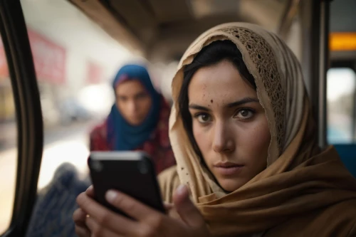 woman holding a smartphone,muslim woman,girl making selfie,hosseinian,unreached,mobile banking,woman sitting,women in technology,people reading newspaper,mobile tablet,the integration of social,islamic girl,woman thinking,lumia,kiarostami,mobilities,praying woman,mobile devices,travel woman,a girl with a camera