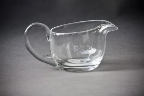 glass mug,beer mug,beer pitcher,glass cup,drinking vessel,tea glass,milk pitcher,wine jug,milk jug,whiskey glass,glassware,carafe,water jug,double-walled glass,pitcher,slug glass,water glass,consommé cup,beer mugs,beer glass