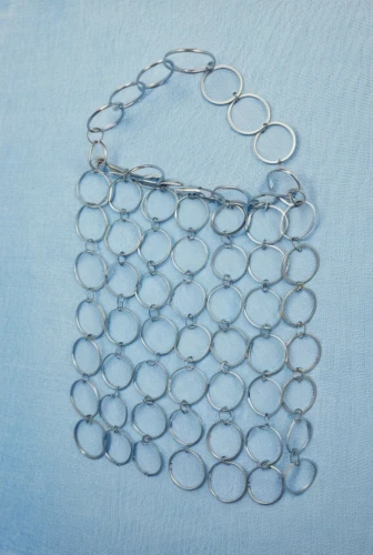 jewelry basket,surgical mask,extension ring,welded wire mesh,wire mesh,split rings,gasket,stents,essure,silver framed glasses,rimless,lace round frames,borosilicate,safety pins,swim ring,metal grille,strainer,tavr,circle shape frame,dna helix,Photography,General,Realistic