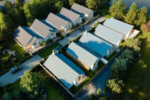 bungalows,aerial view,cabins,aerial shot,aerial photograph,house roofs,boathouses,overhead view,bird's-eye view,acreages,drone image,aerial image,bendemeer estates,lodges,townhomes,view from above,cohousing,boardinghouses,overhead shot,ecovillages,Photography,General,Realistic