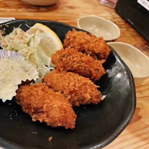 karaage,tonkatsu,menchi-katsu,crispy fried chicken,katsudon,shrimp croquette,fried chicken,chicken tenders,cotoletta,shichimi,fried fish,tempura,shirasu don,fried shrimp,okinawan cuisine,fishcake,fried squid,izakaya,fish stick,fried cauliflower