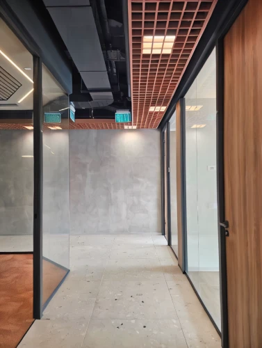 hallway space,prefabricated buildings,recessed,wall completion,conference room,room divider,core renovation,concrete ceiling,modern office,meeting room,structural plaster,sliding door,ceiling construction,corten steel,daylighting,hallway,offices,the server room,corridor,exposed concrete