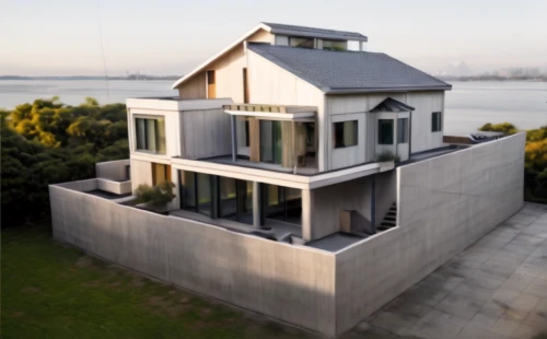 house by the water,dunes house,cubic house,danish house,cube house,frame house,modern architecture,pigeon house,stilt house,metal cladding,modern house,metal roof,luxury real estate,house shape,two story house,contemporary,wooden house,luxury property,inverted cottage,house of the sea