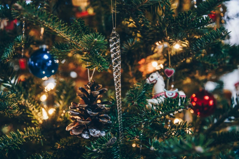 a christmas tree with ornaments hanging on it