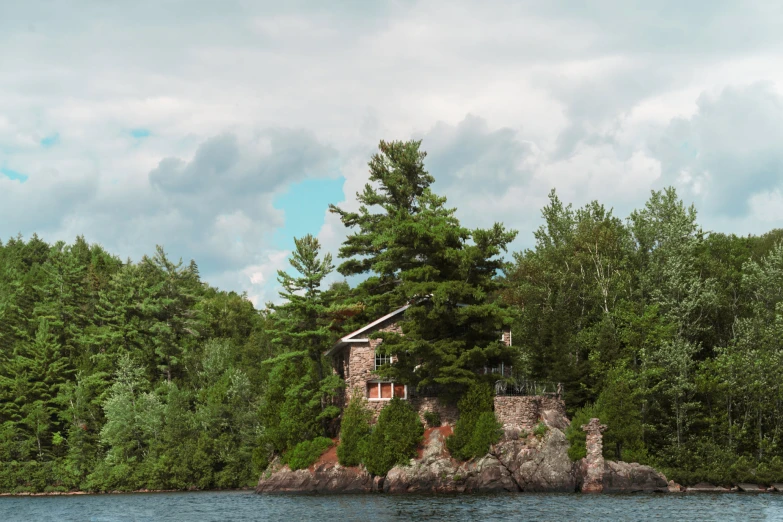 a large house near the forest on the shore