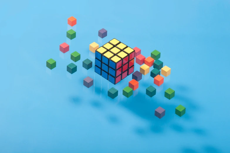 several rubix cubes move around with reflections and shadows