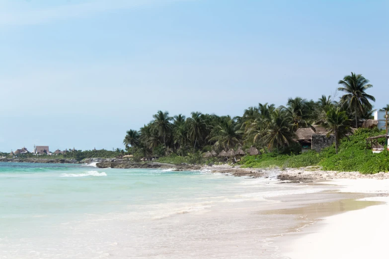 a beach that has houses in it and is shown