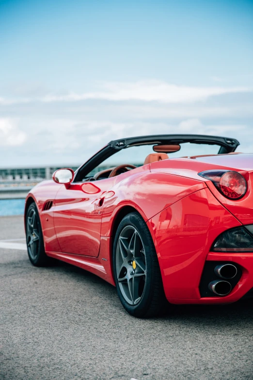 a red sports car with its top down