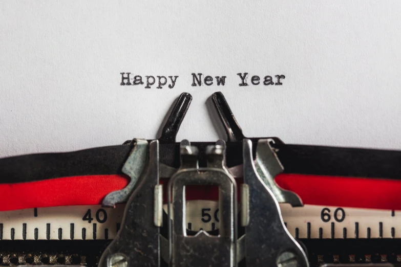 a close up s of the side of a typewriter with a happy new year message on it