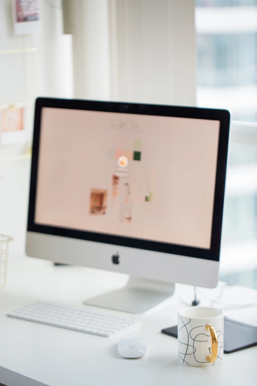 a computer on the desktop with its monitor on