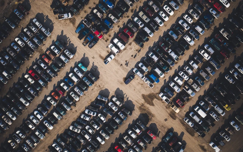 a parking lot is full of parked cars