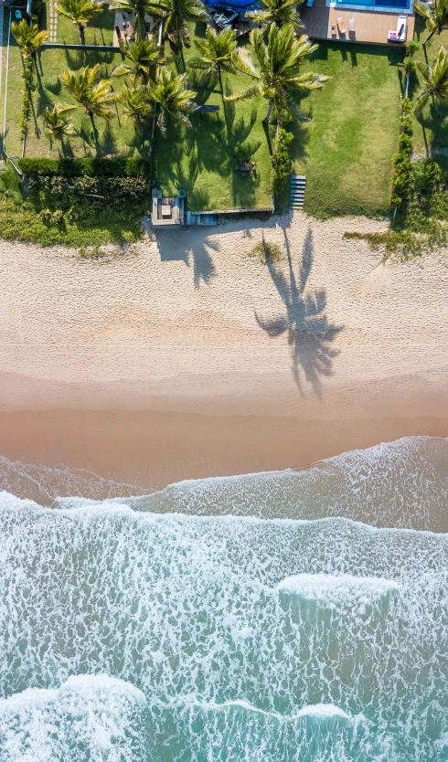 an aerial view shows the ocean and beach area