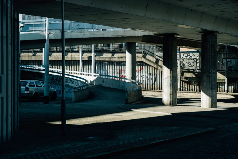 a tunnel under some type of train track near a bridge