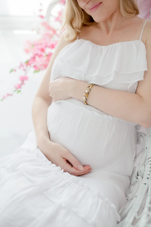 a pregnant woman with an elegant celet