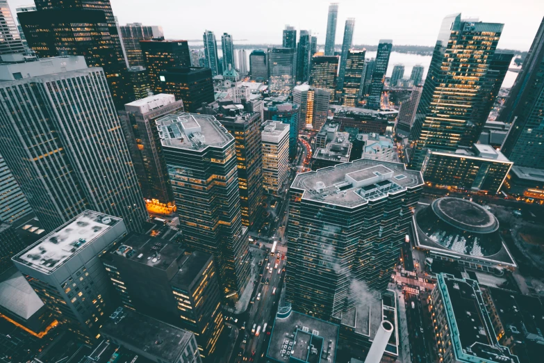 a view of city buildings with snow on them