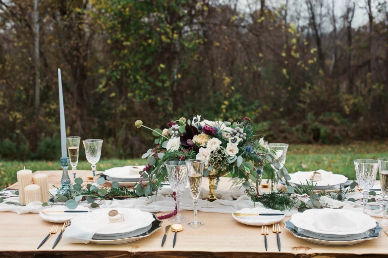 a wedding table in the middle of a field