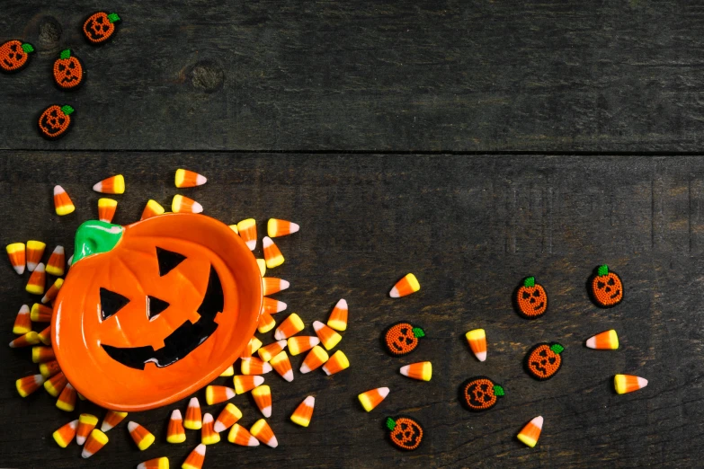 an orange plate with a jack o lanterns design on it