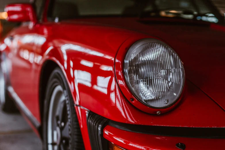 the front end of a red sports car