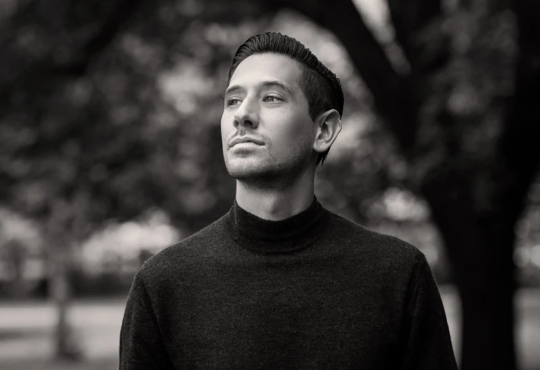 black and white image of young man staring off to the right