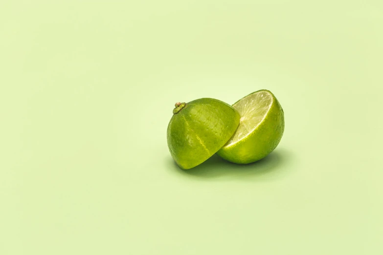 a green apple with a half cut in half