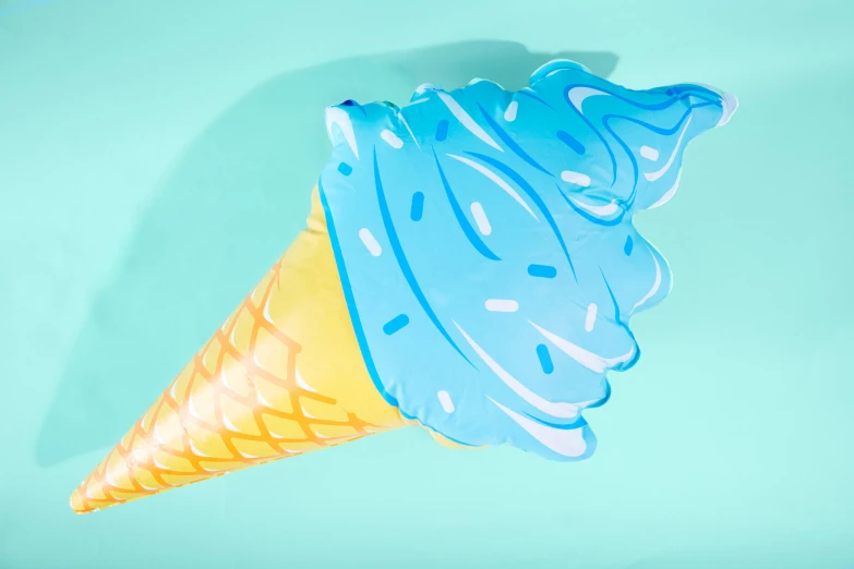 an ice cream cone sitting on top of a blue table