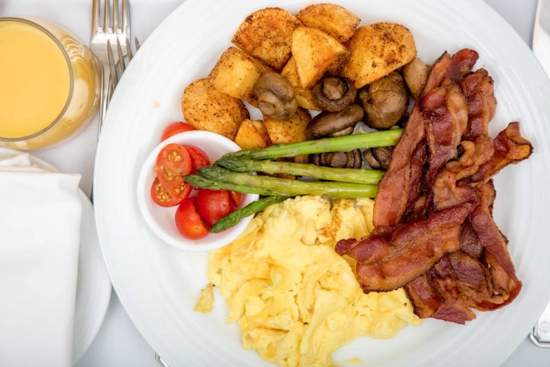 there is a plate that has eggs and various vegetables on it