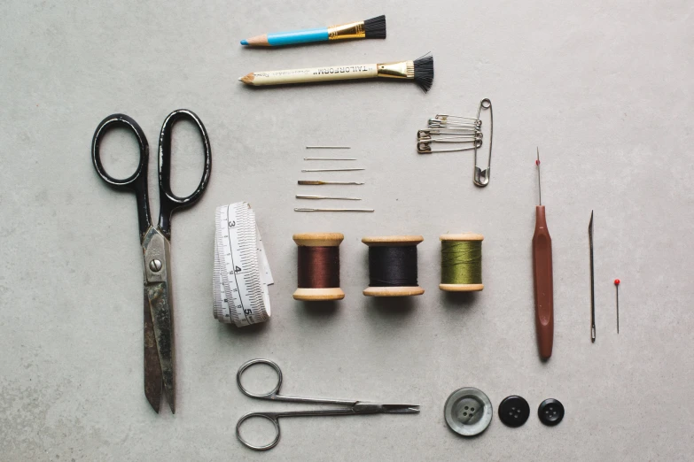 various tools on display laid out for embroidery