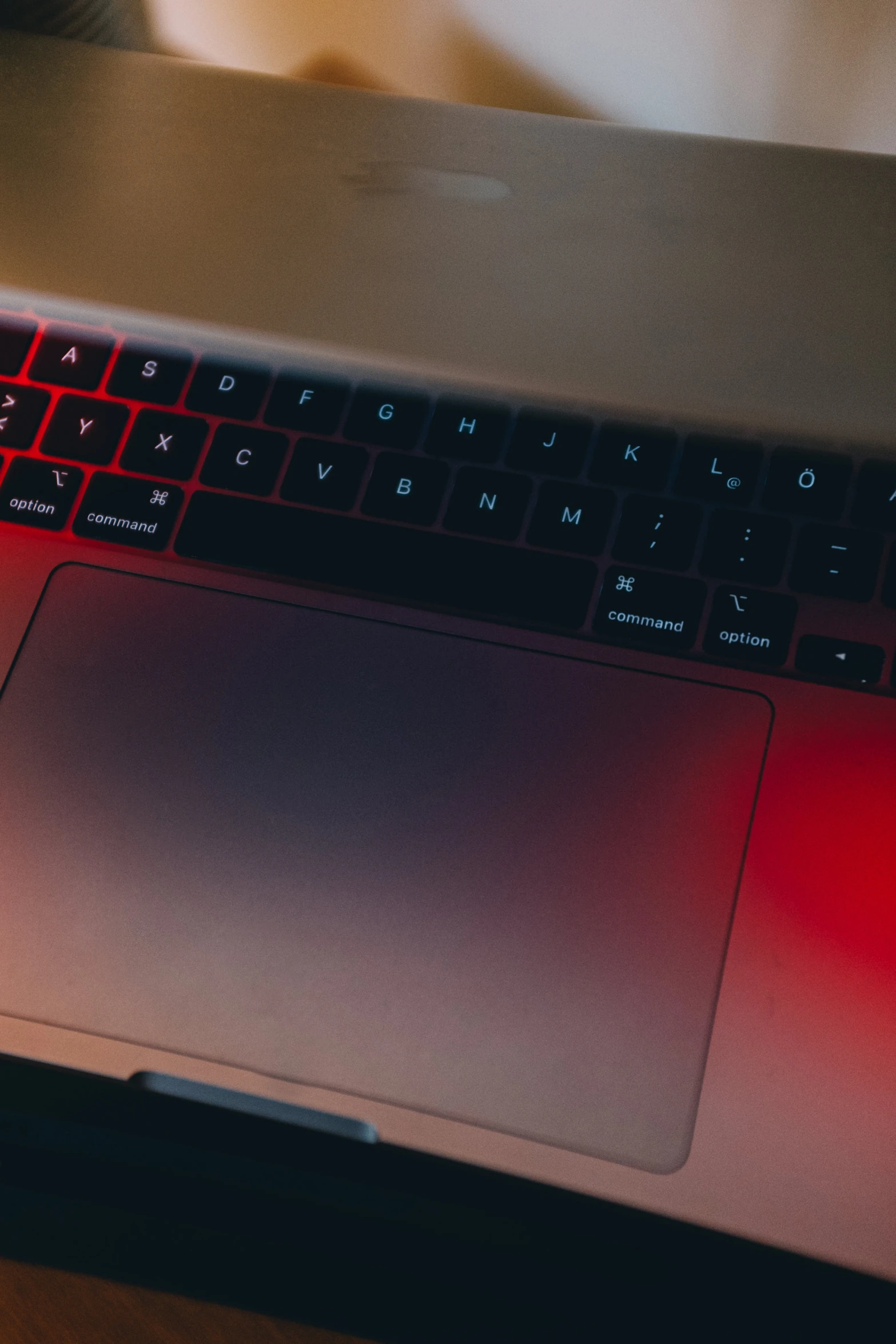 a red and black laptop computer with a keyboard