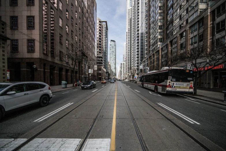 a very long city street lined with tall buildings