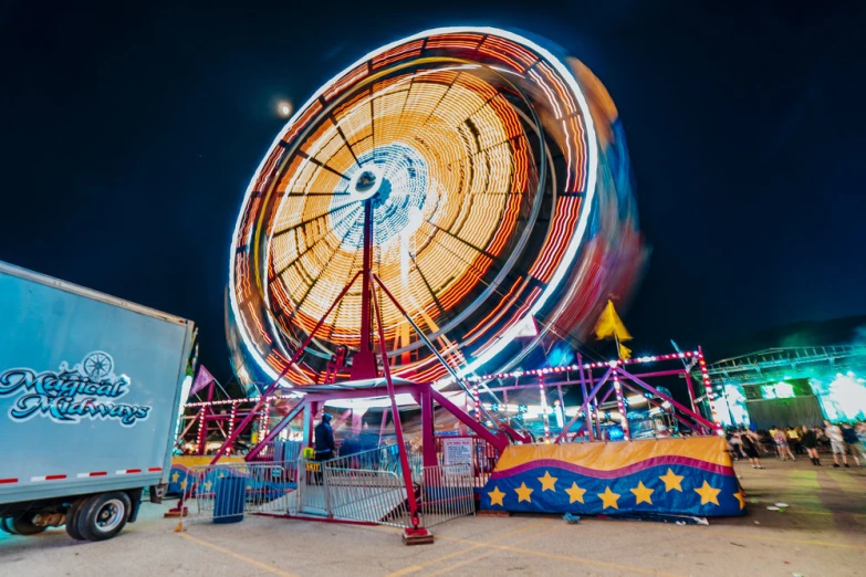 an outdoor carousel with two colorful rides on display