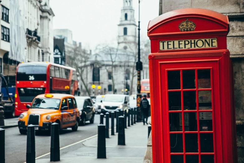 the telephone booth is in the middle of the city