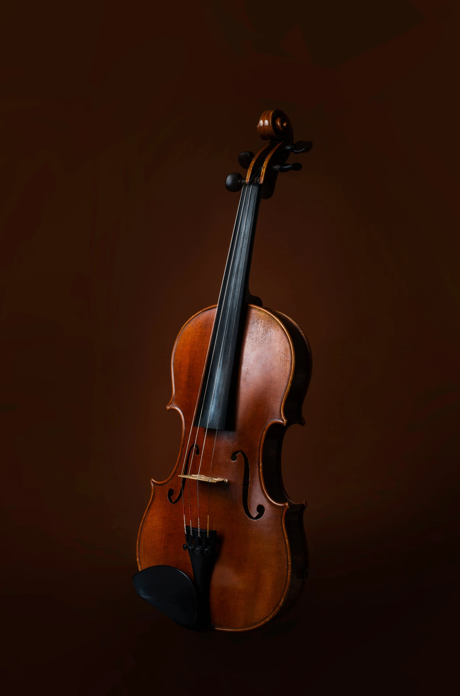 an old violin on a dark background